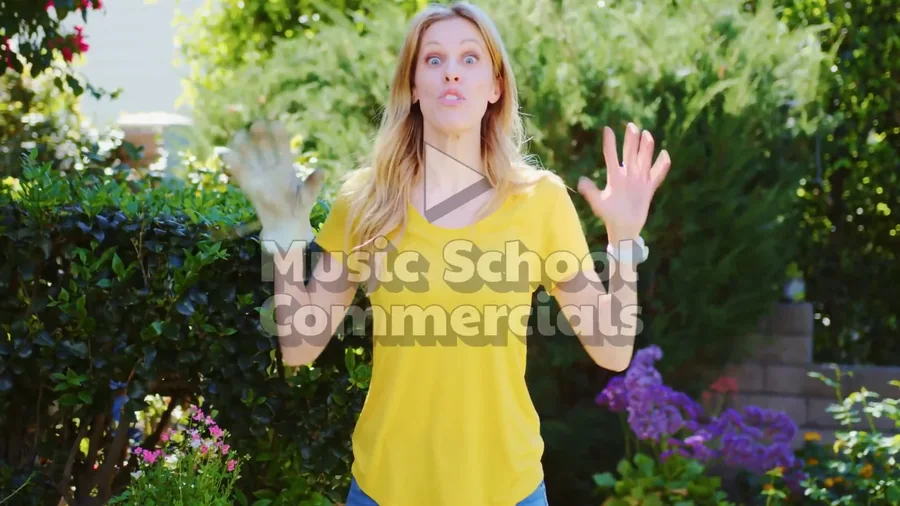 Still frame from the April 2026 music school commercial